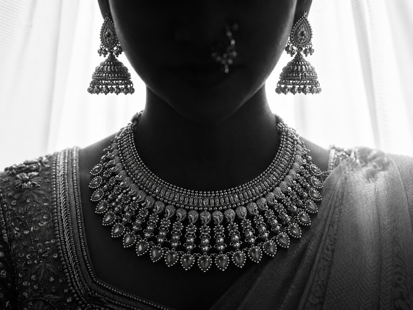 Black and white campaign portrait with statement jewellery
